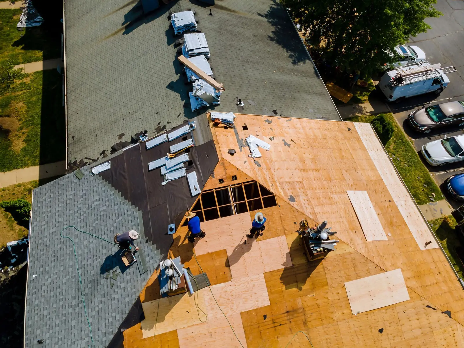 Aerial view of a roof being rebuilt after storm damage