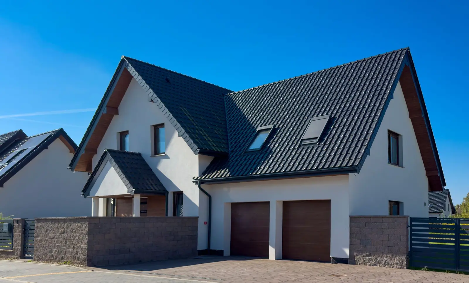 Home with a new roof under a blue sky